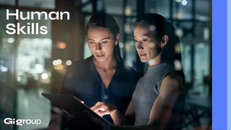 Professionals collaborating in a modern workplace, highlighting the importance of communication, teamwork and human skills.